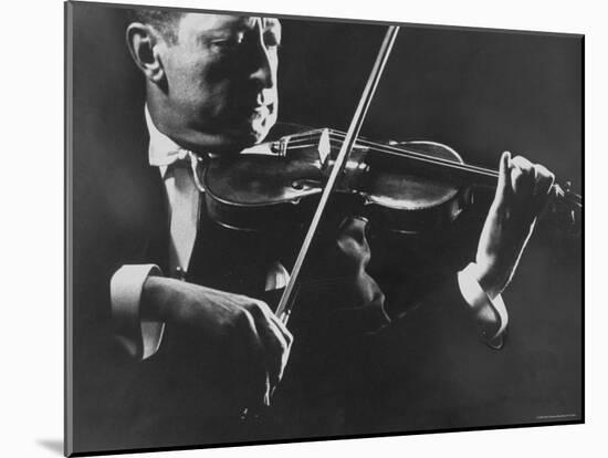 Close Up of Violinist Jascha Heifetz Playing in Mili's Darkened Studio-Gjon Mili-Mounted Premium Photographic Print