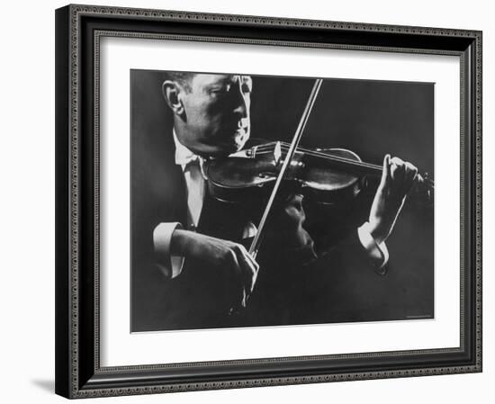 Close Up of Violinist Jascha Heifetz Playing in Mili's Darkened Studio-Gjon Mili-Framed Premium Photographic Print