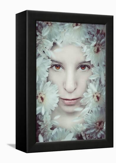 Close Up of Young Girls Face in Flowers-Carolina Hernandez-Framed Premier Image Canvas