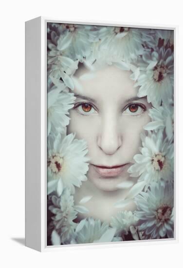 Close Up of Young Girls Face in Flowers-Carolina Hernandez-Framed Premier Image Canvas