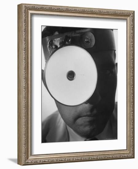 Closeup of a Doctor Wearing a Mask of His Profession-Andreas Feininger-Framed Photographic Print