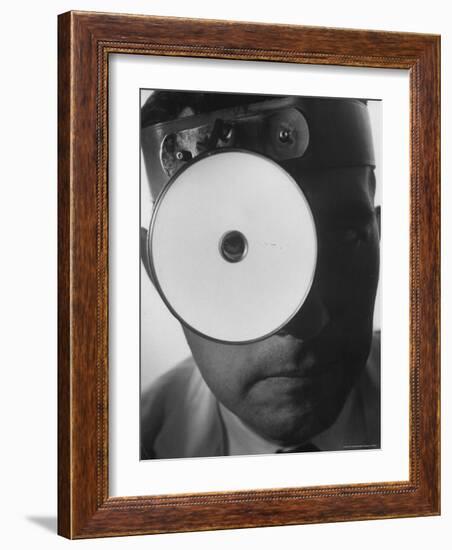 Closeup of a Doctor Wearing a Mask of His Profession-Andreas Feininger-Framed Photographic Print