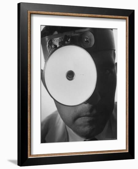 Closeup of a Doctor Wearing a Mask of His Profession-Andreas Feininger-Framed Photographic Print