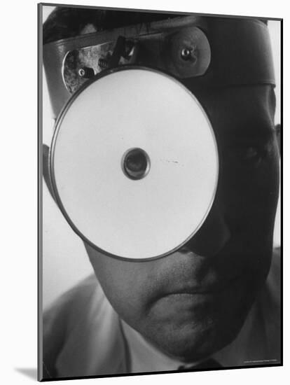 Closeup of a Doctor Wearing a Mask of His Profession-Andreas Feininger-Mounted Photographic Print