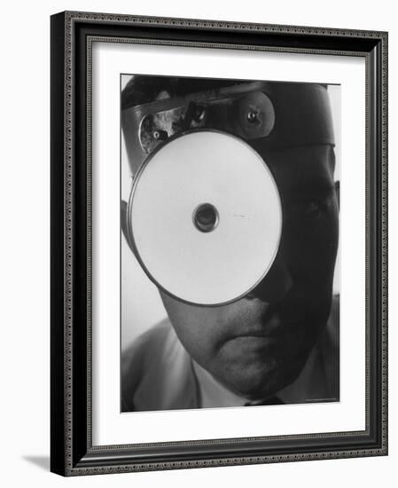Closeup of a Doctor Wearing a Mask of His Profession-Andreas Feininger-Framed Photographic Print