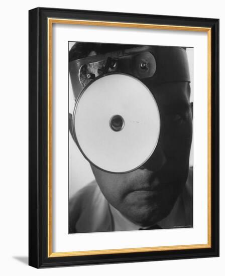 Closeup of a Doctor Wearing a Mask of His Profession-Andreas Feininger-Framed Photographic Print