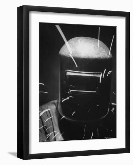 Closeup of a Welder Wearing a Mask-Andreas Feininger-Framed Photographic Print