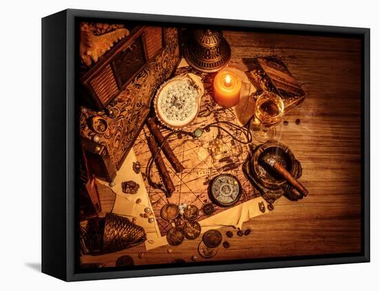 Closeup of Pirates Booty on Wooden Table, Cigars Smoke, Glass of Wine, Map with Way to Search Treas-Anna Omelchenko-Framed Premier Image Canvas