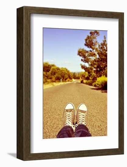 Closeup of the Feet of a Man Lying down on a Road-nito-Framed Photographic Print