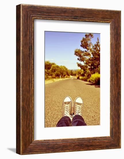 Closeup of the Feet of a Man Lying down on a Road-nito-Framed Photographic Print