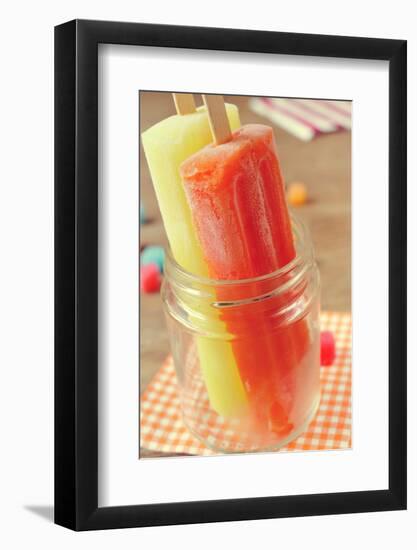 Closeup of Two Appetizing Ice Pops of Different Flavors in a Glass Jar-nito-Framed Photographic Print