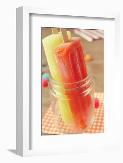 Closeup of Two Appetizing Ice Pops of Different Flavors in a Glass Jar-nito-Framed Photographic Print