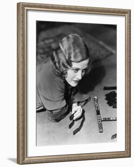 Closeup of Woman Playing Dominos-null-Framed Photo