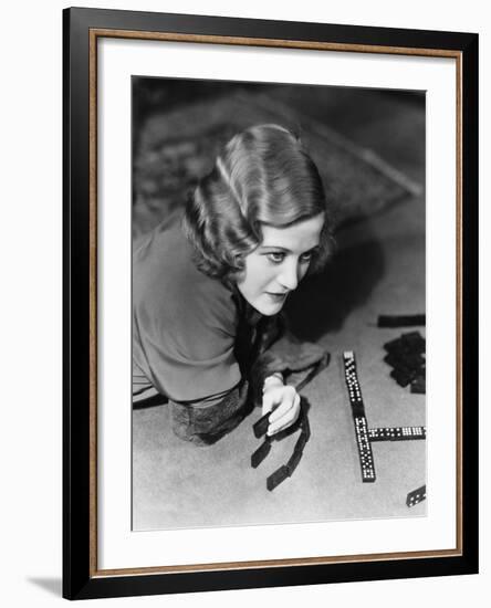 Closeup of Woman Playing Dominos-null-Framed Photo