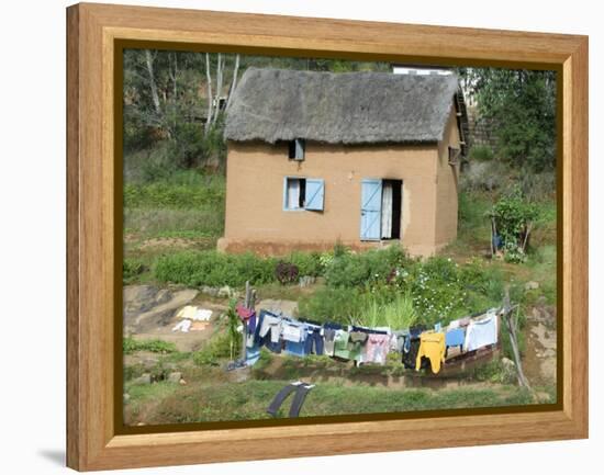 Clothes Drying on a Clothesline in Front of a House, Madagascar-null-Framed Premier Image Canvas