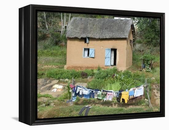 Clothes Drying on a Clothesline in Front of a House, Madagascar-null-Framed Premier Image Canvas