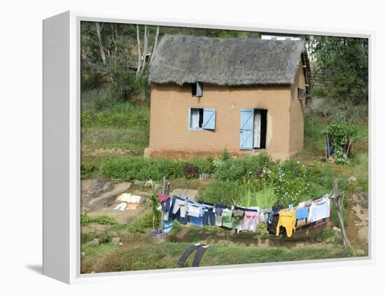 Clothes Drying on a Clothesline in Front of a House, Madagascar-null-Framed Premier Image Canvas