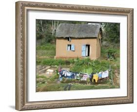 Clothes Drying on a Clothesline in Front of a House, Madagascar-null-Framed Photographic Print