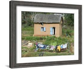 Clothes Drying on a Clothesline in Front of a House, Madagascar-null-Framed Photographic Print