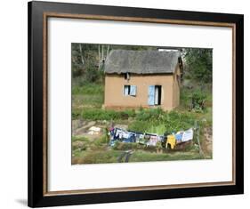 Clothes Drying on a Clothesline in Front of a House, Madagascar-null-Framed Photographic Print
