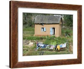 Clothes Drying on a Clothesline in Front of a House, Madagascar-null-Framed Photographic Print