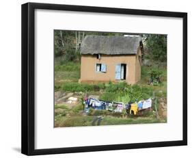 Clothes Drying on a Clothesline in Front of a House, Madagascar-null-Framed Photographic Print