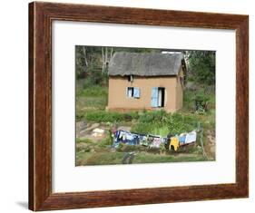 Clothes Drying on a Clothesline in Front of a House, Madagascar-null-Framed Photographic Print