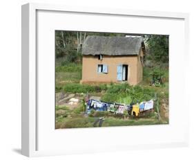 Clothes Drying on a Clothesline in Front of a House, Madagascar-null-Framed Photographic Print