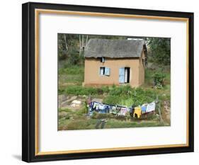 Clothes Drying on a Clothesline in Front of a House, Madagascar-null-Framed Photographic Print