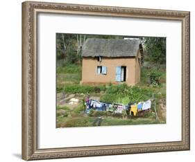Clothes Drying on a Clothesline in Front of a House, Madagascar-null-Framed Photographic Print