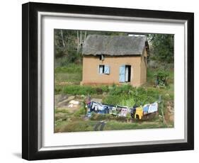 Clothes Drying on a Clothesline in Front of a House, Madagascar-null-Framed Photographic Print