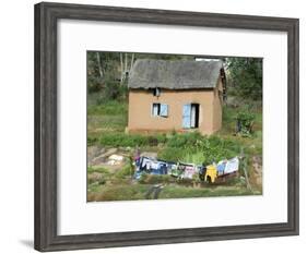Clothes Drying on a Clothesline in Front of a House, Madagascar-null-Framed Photographic Print