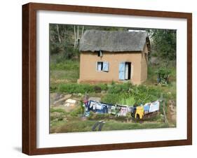 Clothes Drying on a Clothesline in Front of a House, Madagascar-null-Framed Photographic Print