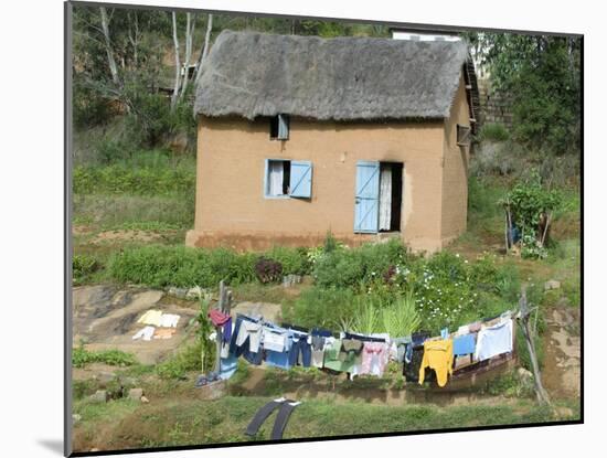 Clothes Drying on a Clothesline in Front of a House, Madagascar-null-Mounted Photographic Print