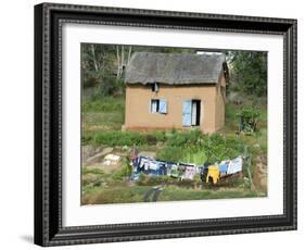 Clothes Drying on a Clothesline in Front of a House, Madagascar-null-Framed Photographic Print