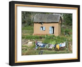 Clothes Drying on a Clothesline in Front of a House, Madagascar-null-Framed Photographic Print