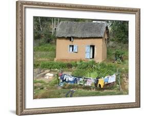 Clothes Drying on a Clothesline in Front of a House, Madagascar-null-Framed Photographic Print