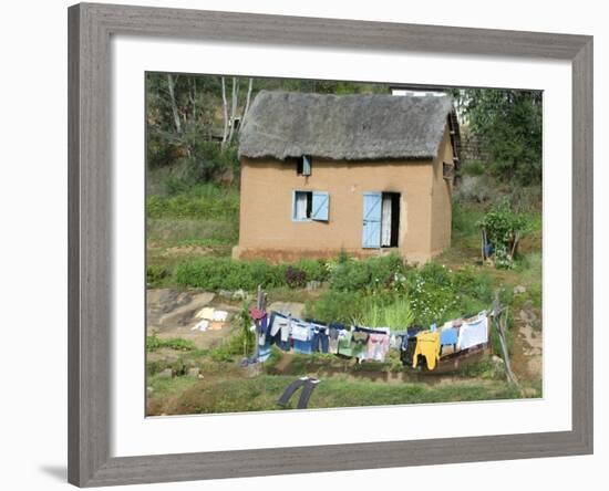 Clothes Drying on a Clothesline in Front of a House, Madagascar-null-Framed Photographic Print