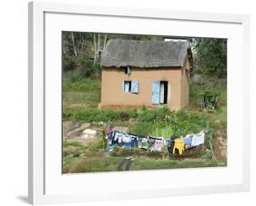 Clothes Drying on a Clothesline in Front of a House, Madagascar-null-Framed Photographic Print