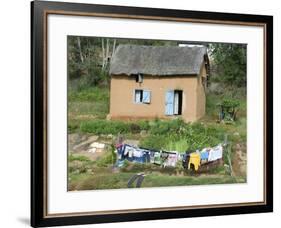 Clothes Drying on a Clothesline in Front of a House, Madagascar-null-Framed Photographic Print