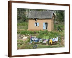 Clothes Drying on a Clothesline in Front of a House, Madagascar-null-Framed Photographic Print