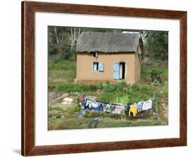 Clothes Drying on a Clothesline in Front of a House, Madagascar-null-Framed Photographic Print