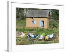 Clothes Drying on a Clothesline in Front of a House, Madagascar-null-Framed Photographic Print