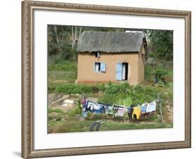 Clothes Drying on a Clothesline in Front of a House, Madagascar-null-Framed Photographic Print
