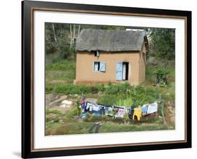 Clothes Drying on a Clothesline in Front of a House, Madagascar-null-Framed Photographic Print