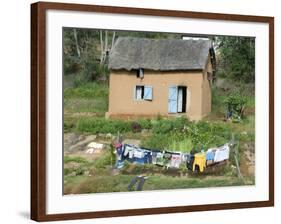 Clothes Drying on a Clothesline in Front of a House, Madagascar-null-Framed Photographic Print