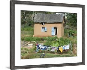 Clothes Drying on a Clothesline in Front of a House, Madagascar-null-Framed Photographic Print