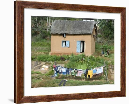 Clothes Drying on a Clothesline in Front of a House, Madagascar--Framed Photographic Print