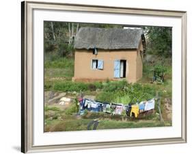 Clothes Drying on a Clothesline in Front of a House, Madagascar-null-Framed Photographic Print