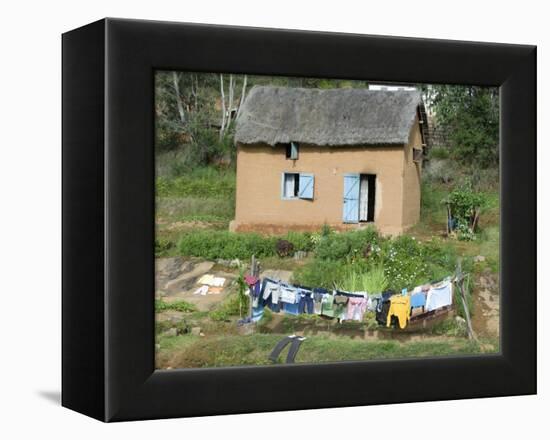 Clothes Drying on a Clothesline in Front of a House, Madagascar-null-Framed Premier Image Canvas